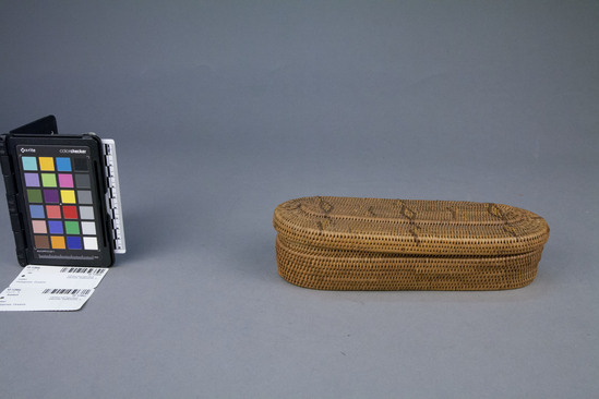 Hearst Museum object 2 of 2 titled Basket and lid, accession number 10-1286a,b, described as Basket with cover; coiled; oval; yellow and brown diamond design on cover; 9½ x 3½ x 2 inches