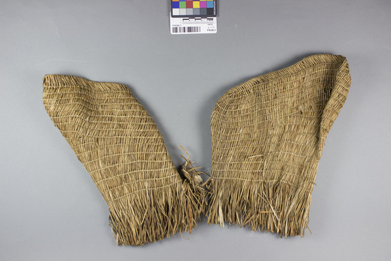 Hearst Museum object titled Socks, accession number 2-19078a,b, described as Pair of woven straw colored grass.