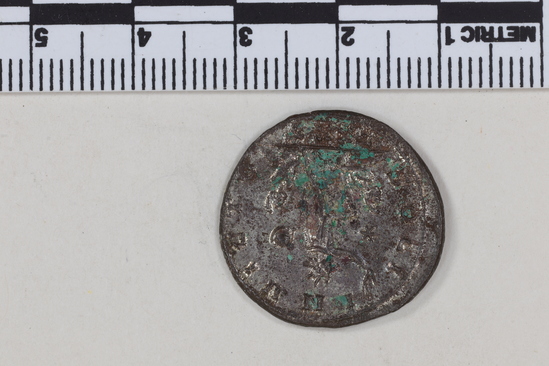 Hearst Museum object 3 of 8 titled Coin: billon antoninianus, accession number 8-4036, described as Coin; AG; Billon. Antoninianus; Roman. Aurelian, 270-275 AD. Obverse: IMP C AVRELIANVS AVG, Bust r. radiate. Reverse: SOLI INVICTO, Sol striding l., two captives at feet; * in left field; in ex., TXXT.