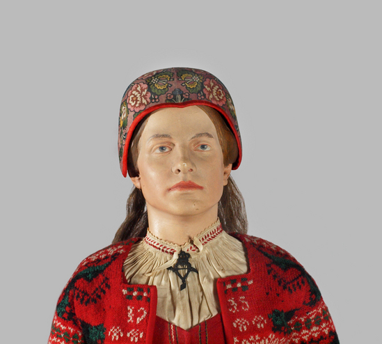 Hearst Museum object 6 of 6 titled Doll with costume, accession number 7-399, described as Female doll showing peasant’s costume of Delsbo Parish, Halsingland.  "1915" embroidered on purse and in brass.