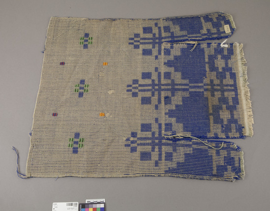 Hearst Museum object titled Textile, accession number 9-16306, described as Textile, woven, geometric pattern; blue, green, orange; 2 vertical slits cut in one end. 71.0 cm x 63.0 cm