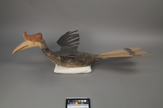 Hearst Museum object titled Figurine, accession number 18-46, described as Wooden model of hornbill with tin wings.