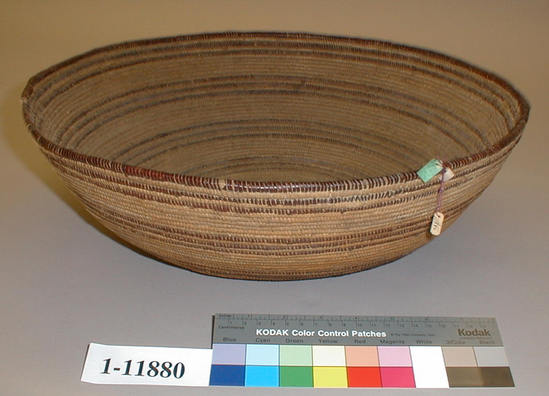 Hearst Museum object titled Cooking basket, accession number 1-11880, described as Hemispherical flat bottomed coiled basket.  Two tags: "Yuki". Per Ralph Shanks:  Wide brimmed coiled cooking basket.  There is some residue on the bottom interior as well as abrasions and two burns on the interior wefts.  The starting knot is twined and sewn over.  The coil foundation is peeled redbud shoot rods and splints.  The weft background is peeled redbud and the weft design is unpeeled redbud.  The design is five sets of three horizontal bands of redbud with a break in the design that lines up.  There are three unique designs at the breaks, including an area of checkering, near the rim.  There are no random rectangles, which is unusual for a Yuki basket. The rim is entirely in unpeeled redbud.  The coil ending is blunt with three diagonal overstitches. The weft fag ends are bound under.  The weft moving ends are concealed.  The weft stiches on the exterior are less than 5% split.  The weft stiches on the interior are more than 50% split.  The basket has an exterior workface, a rightward work direction, and a down to the right slant of weft twist.