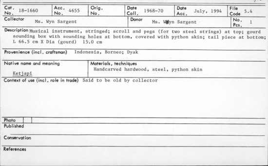 Documentation associated with Hearst Museum object titled Musical instrument, accession number 18-1660, described as Musical instrument, stringed; scroll and pegs (for two steel strings) at top; gourd sounding box with sounding holes at bottom, covered with python skin; tail piece at bottom. Said to be old by collector. Length 66.5 cm. Diameter (gourd) 15.0 cm.