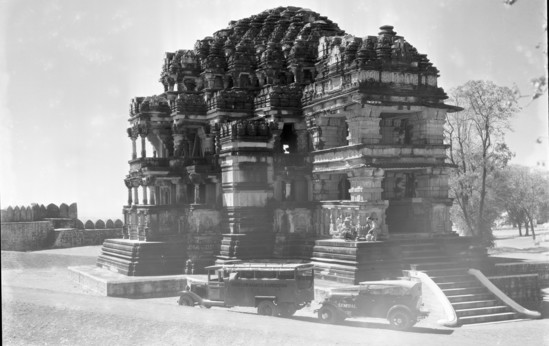 Hearst Museum object titled Black-and-white negative, accession number 15-30523, described as 8 x 10" Black and white negative of the Sas Bahu Temple. Hoefler and Dudley (his brother) looking at the temple.  Hoefler's original description: "Gwalior State, Central India. The Sas Bahu, or Mother-in-law Temple, which stands on top of the flat mountain in Gwalior. Photograph shows Paul L. Hoefler, to the right, and his brother Dudley inspecting some of the wonderful carvings for which this Temple is noted. The amount of work expended in the building of this edifice and the smaller Daughter-in-law Temple, which stands close by, would be hard to calculate, but those who labored, did so with religious fervor, because these temples were dedicated to Vishnu, one of the Trinity worshipped by the Hindus."