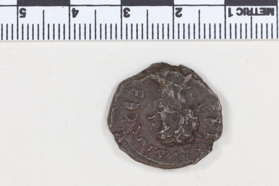 Hearst Museum object 6 of 8 titled Coin: billon, accession number 8-4837, described as Coin; Billon; Greek. 6.84 grams, 22 mm. Claudius II, 268-269 AD. Alexandria, Egypt. Obverse: AYTK KLAYΔΙΟC CEB, bust r. laureate. Reverse: Eagle l.; to right, monogram.