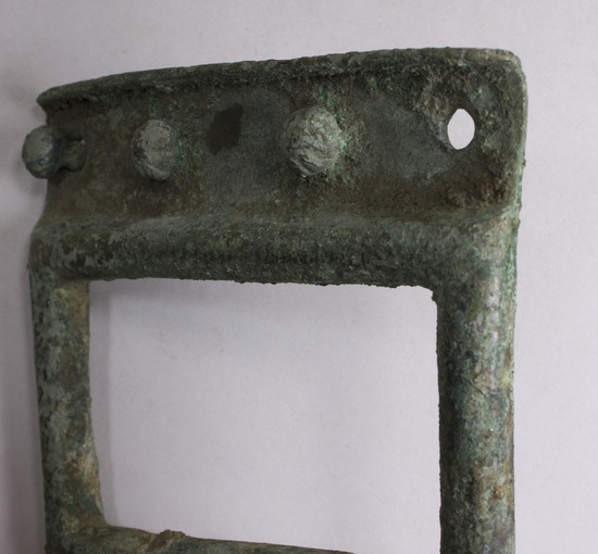 Hearst Museum object 11 of 14 titled Belt clasp, accession number 8-1345, described as Huge knob belt clasp; bronze; places for four rivets on each side