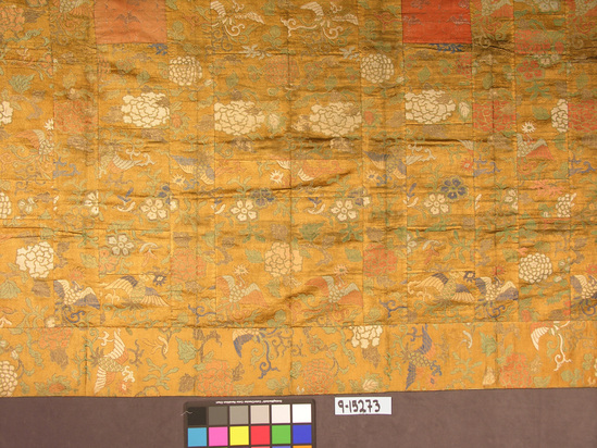 Hearst Museum object titled Textile, accession number 9-15273, described as Hanging? Priest's robe? Silk, gilt paper wrapped yarns. Compound twill weave, brocaded; plain weave lining. Varicolored; lining of 1 set blue, 1 set red threads. Phoenix, floral motives. 82 inches by 45½ inches.