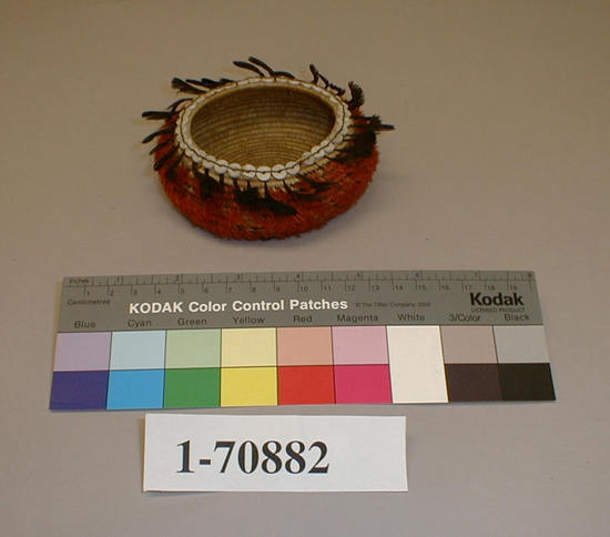 Hearst Museum object titled Bowl basket, accession number 1-70882, described as Coiled, bowl shaped.  Feathers over surface.  Bead ornaments.