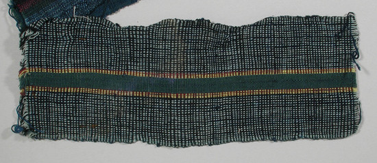 Hearst Museum object titled Textile fragment, accession number 5-11215, described as textile sample (section of narrow band weaving): alternating black and pale blue threads on side panels; central stripe of green flanked by yellow and maroon threads alternating.