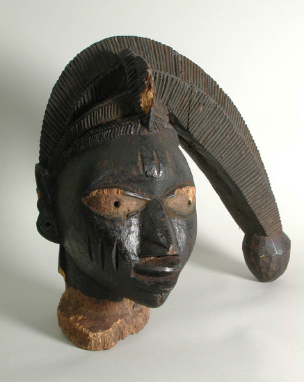 Hearst Museum object titled Mask, accession number 5-2587, described as Yoruba 'Egungun' mask;  whole head painted black;  woman?;  12 1/2" high;  represents [handwritten on card:  the God]  'Eshu'.  [handwritten on card:  31.75 cm]