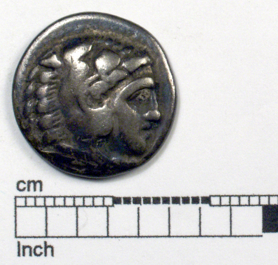 Hearst Museum object titled Coin: ar drachm, accession number 8-4421, described as Coin; AR; Drachma; Greek. 4.10 grams, 18 mm. Alexander the Great, 330-323 BC. Obverse: bust of Heracles r. Reverse: ΑΛΕΞΑΝΔΡΟΥ, Zeus seated l., eagle on outstretched right hand, scepter in left hand; to l., thunderbolt; beneath throne, monogram.