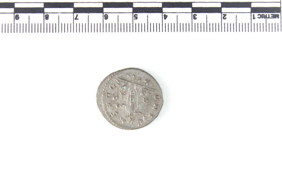 Hearst Museum object 6 of 8 titled Coin: billon antoninianus, accession number 8-4043, described as Coin; AG; Billon. Antoninianus; Roman. 3.60 grams, 24 mm. Aurelian, 270-275 AD. Obverse: IMP AVRELIANVS AVG, Bust r. radiate. Reverse: ORIENS AVG, Sol striding l., two captives at his feet; P in field r., in exergue XXI