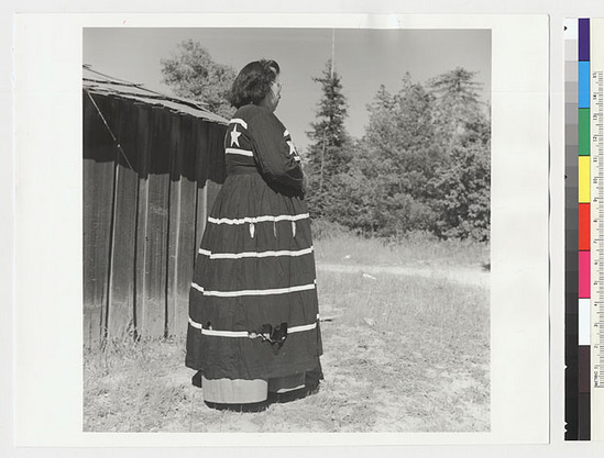 Hearst Museum object titled Black-and-white negative, accession number 15-20224, described as Essie Parrish in a black dancing dress; side view