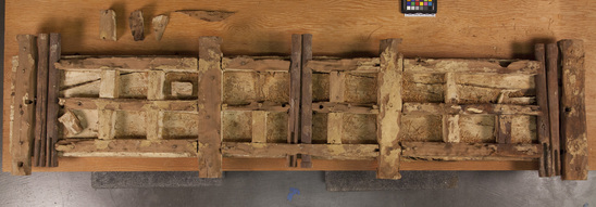 Hearst Museum object titled Coffin base, accession number 6-23702b, described as Base (b), planks of wood secured with a lattice construction of rough wooden dowels on top and bottom.