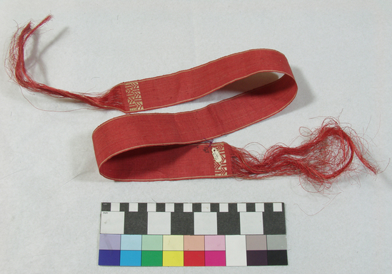 Hearst Museum object titled Belt, accession number 11-210, described as Belt or ribbon of fiber, red.