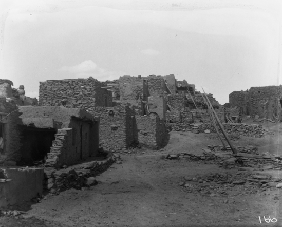 Hearst Museum object titled Black-and-white negative, accession number 15-166, described as view similar to 15-165, houses and two kivas in foreground