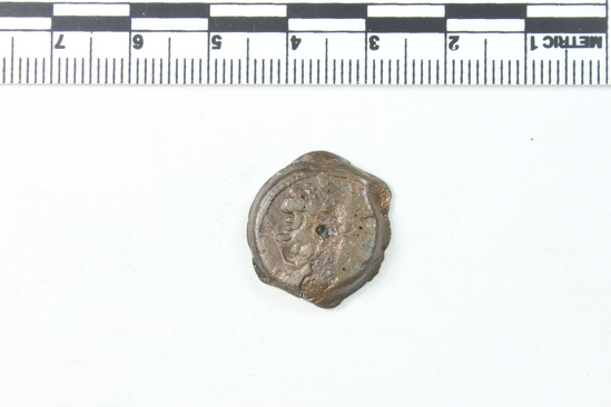 Hearst Museum object titled Coin: æ, accession number 6-22520, described as Diademed head of Zeus Ammon, r. central hole