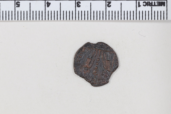 Hearst Museum object 7 of 8 titled Coin: æ 4, accession number 8-7324, described as Coin, AES Follis 4.      1.05 grams. 14mm. Obverse: Constantinus II Reverse: 1 Standard between 2 soldiers