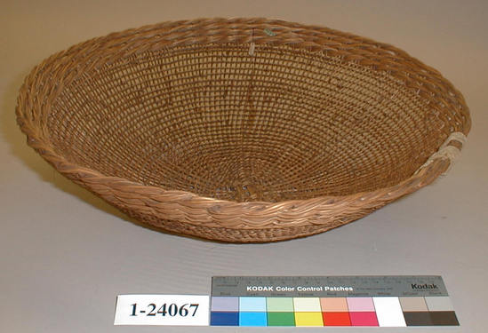 Hearst Museum object titled Basket, accession number 1-24067, described as Openwork twined basket.  4 heavy twisted bands around rim, supported by cotton string wrapping.