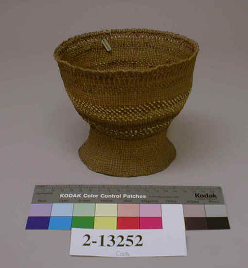 Hearst Museum object 2 of 3 titled Basket, accession number 2-13252, described as Tule, shaped like egg cup. Close twining with banded light and dark design.