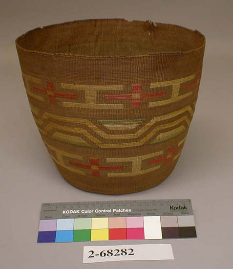 Hearst Museum object titled Basket, accession number 2-68282, described as Twined spruce root, false embroidery. Round with concave bottom, circular geometric design, colors faded, on brown ground. Top area and rim broken in several areas.