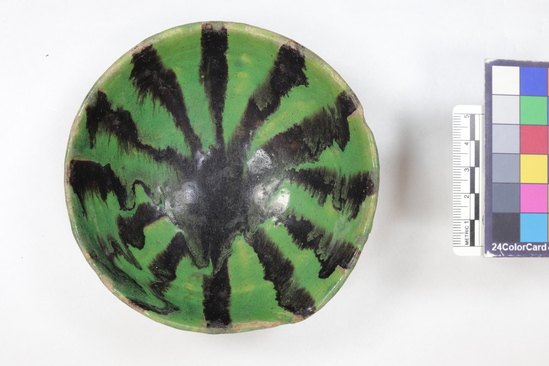 Hearst Museum object 5 of 5 titled Bowl, accession number 6-20276, described as Pottery bowl, green glaze, black stripes; diameter 12 cm. Arabic