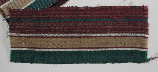 Hearst Museum object titled Textile fragment, accession number 5-11258, described as textile sample (section of narrow band weaving): maroon stripe with thin green centered stripe, tan stripe flanked by white and maroon on each side, green stripe.