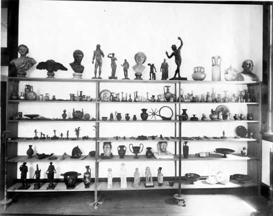 Hearst Museum object titled Photograph, accession number 13-370, described as Group of Graeco-Roman pottery, glass, and bronzes. Part of the Emerson collections in the Museum.