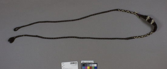 Hearst Museum object titled Sling, accession number 16-2457, described as Sling; braided black and white sheep wool, zig zag design called “paki” in Quenchua, woven by hand/ used by an animal herder