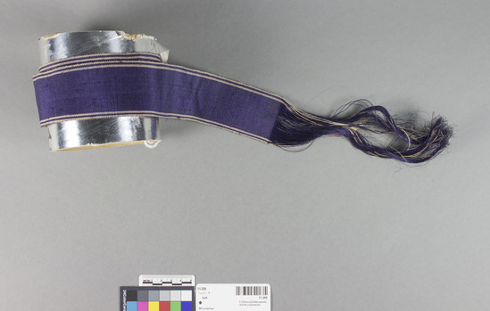 Hearst Museum object 2 of 3 titled Belt, accession number 11-209, described as Belt or ribbon of fiber, violet.