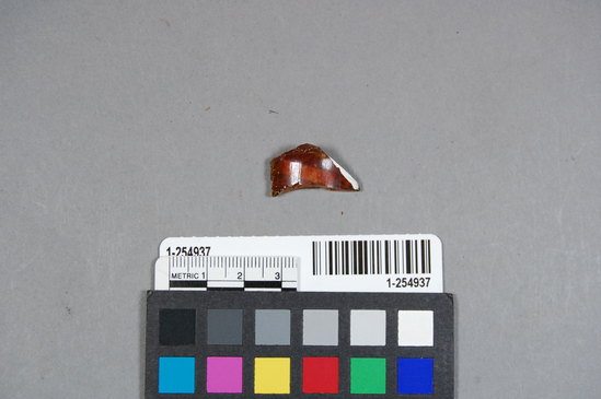 Hearst Museum object titled Bottle fragment, accession number 1-254937, described as Fragment of brown bottle glass