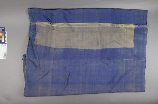 Hearst Museum object titled Textile, accession number 9-16308, described as Textile, woven; blue, gray, purple; shiny finish; numerous stains. 191.5 cm x 57.5 cm