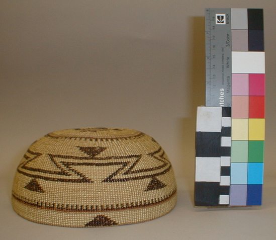 Hearst Museum object titled Cap, accession number 1-1831, described as Hat; twined. Warp is Hazel (Corylus cornuta californica), weft is Sugar pine root (Pinus lambertiana). White pattern is Beargrass (Xerophyllum tenax). Black pattern is Maidenhair fern (Adiantum pedatum). Red dye is Chain fern (Woodwardia spinulosa) in Alder (Alnus rubra).