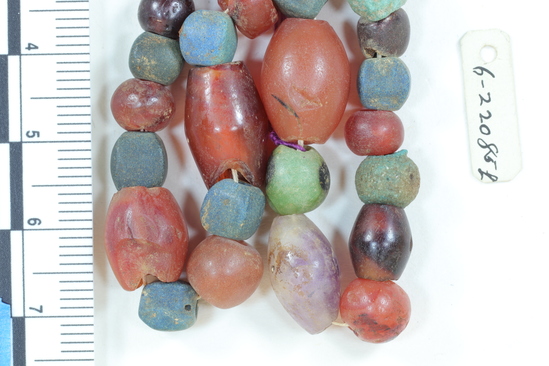 Hearst Museum object 4 of 5 titled Beads, accession number 6-22085, described as beads: a) blue frit cubes, carnelian, one amethyst b) small blue frit, etc. c) blue-green faience