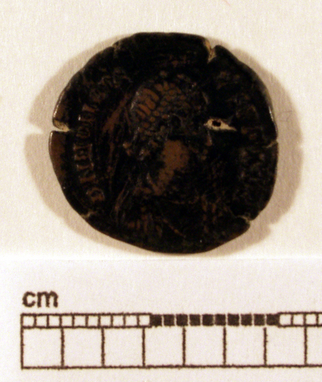 Hearst Museum object titled Coin: æ, accession number 8-8153, described as Coin. Bronze, 3 mm. diameter, 1.963 grams. Obverse: Head of Honorius, facing right. Reverse: Standing figure. Inscribed.