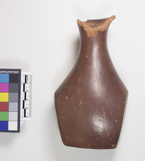 Hearst Museum object 9 of 12 titled Broken bottle, accession number 6-3214, described as Pottery: red bottle flat bottom two flat sides slender neck broken gd 8 cm, height 15 cm