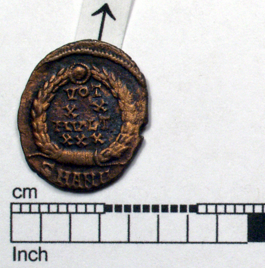 Hearst Museum object 2 of 6 titled Coin: æ 4, accession number 8-7020, described as Coin: Aes Folles; Æ; size: 16 mm; weight: 1.62 grams; condition: good. Obverse: head turned right, with double pearl diadem with forehead jewel; inscription: DN CONSTAN  TIUS  PF AUG. Reverse: wreath with inscription, VOT/X X/MULT/XXX; in exergue, SMAN[untranscribable symbol].