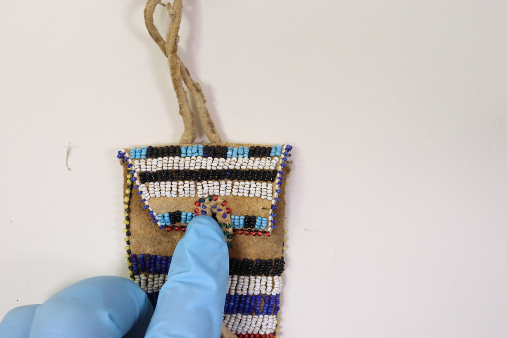 Hearst Museum object 3 of 4 titled Sheath, accession number 2-9377, described as Buckskin; beaded white/blue/black/red/green/yellow.  For knife.