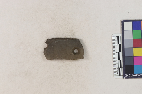 Hearst Museum object titled Potsherd, accession number 16-8124, described as Potsherd; body, two drilled holes. Section of Manta on Beach currently inhabited. Numbers  8111 to 8194 are sherds picked up on beach at low tide.