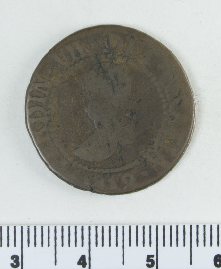Hearst Museum object titled Coin, accession number 7-4277, described as Spanish coin, copper, twelve pesta, obverse head of Ferdinand VII, reverse crown and shield, date 1819 (?).