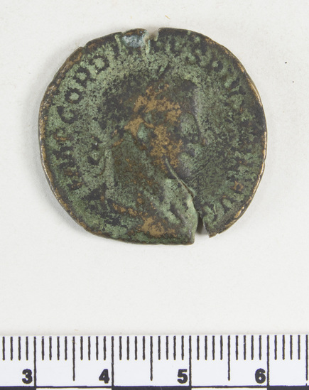 Hearst Museum object 2 of 8 titled Coin: æ sestertius, accession number 8-6194, described as Coin: Sestertius (?); Æ; Gordianus III - 15.36 grms. Obverse: IMP GORDIANVS PIVS FEL AVG - Bust facing right, laureate, draped, cuirassed. Reverse: FELICIT TEMPOR, SC - Felicitas standing holding long caduceus and cornucopiae.