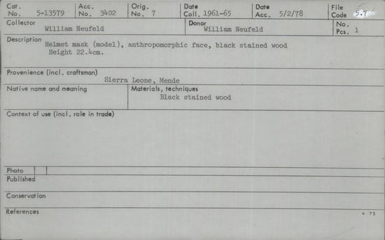 Documentation associated with Hearst Museum object titled Helmet mask, accession number 5-13579, described as helmet mask (model), anthropomorphic face, black stained wood.  height 22.4 cm.