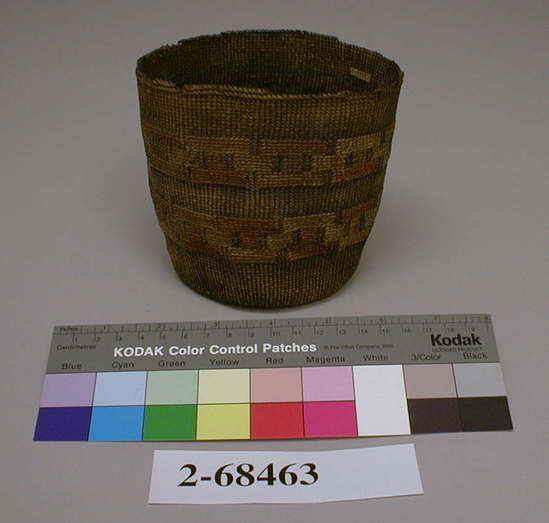 Hearst Museum object titled Basket, accession number 2-68463, described as Round with concave bottom, straight sides, 2 bands of geometric false embroidery, colors faded, badly stained throughout, edge broken in several areas. Spruce root, grass stems, dyed, plain twined.