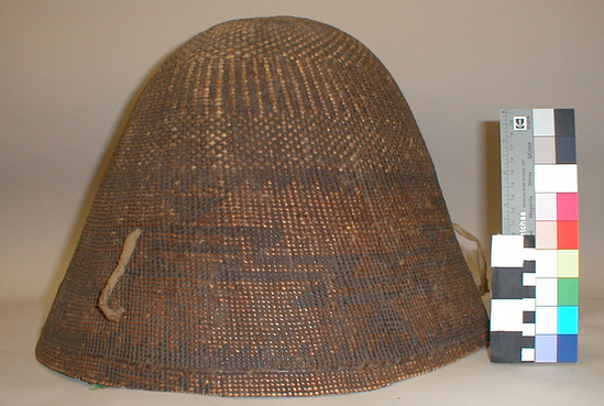 Hearst Museum object titled Storage basket, accession number 1-11791, described as Storage basket; twined. Warp is Hazel (Corylus cornuta californica), weft is Sugar pine (Pinus lambertiana). White pattern is Beargrass (Xerophyllum tenax). Plain twined with three strand twining in lower area, design of diagonal and vertical stripes in lower area. Triangular geometric design in upper area. Three loops of cotton cloth attached at rim. Darkened overall. Start broken, rim broken in some areas.