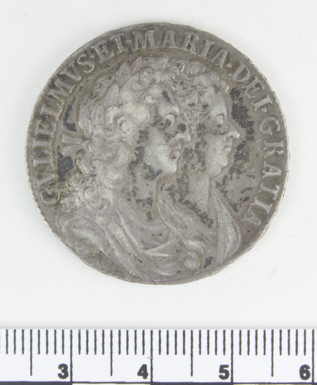 Hearst Museum object 2 of 4 titled Coin, accession number 7-2782, described as Silver; Obverse: GVLIEL. MUS. ET. MARIA. DEI. GRATIA' Reverse: MAG. BR. FR. ET. HIB. REX. ET. REGINA 1689; 14.77 grams.