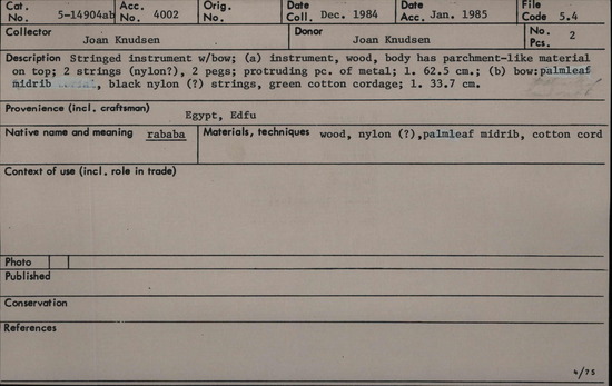 Documentation associated with Hearst Museum object titled Musical instrument, accession number 5-14904a,b, described as Stringed instrument with bow (native name: rababa); (a) instrument, wood, body has parchment-like material on top; two strings (nylon?), two pegs, protruding piece of metal; length 62.5 cm; (b) bow: palmleaf midrib, black nylon (?) strings, green cotton cordage; length 33.7 cm.