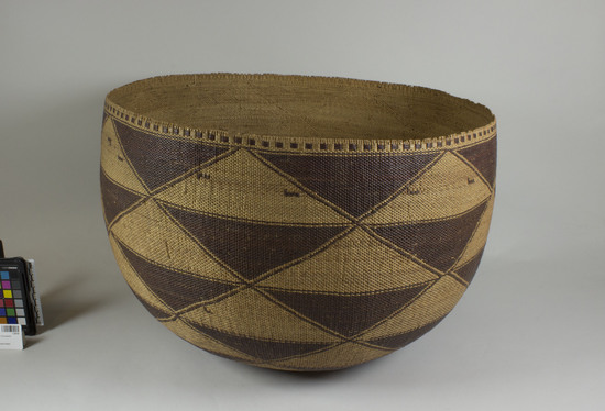 Hearst Museum object 2 of 2 titled Basket, accession number 1-28795, described as Twined. Overlay design in brown triangle.