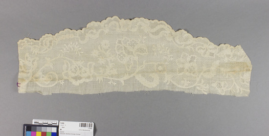 Hearst Museum object titled Lace, accession number 7-3436, described as Lace; linen; tönder drawn work; floral designs on geometric ground, scalloped border 6.5" x 20" irregular; 18th century