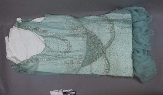 Hearst Museum object 2 of 2 titled Dress, accession number 2-63377a,b, described as Dress. Silk rhinestones. Chiffon dress, chiffon overskirt; both trimmed with rhinestones. Blue green